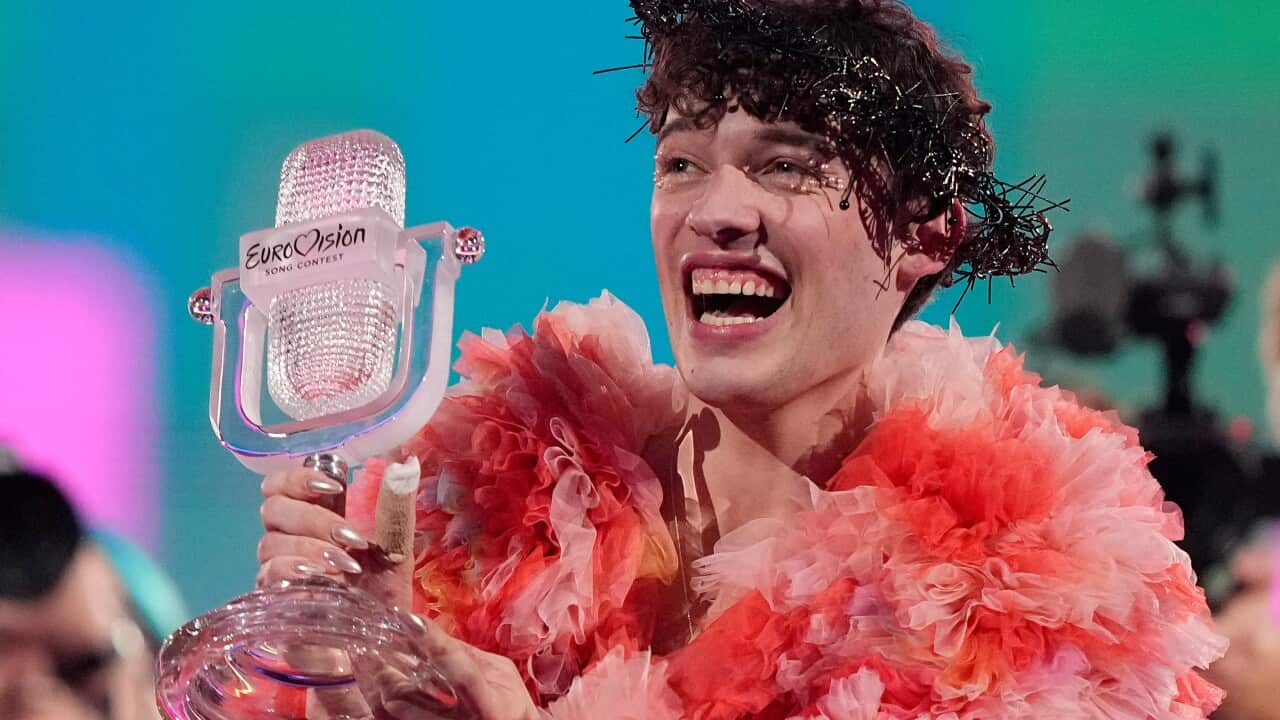 Nemo of Switzerland, holds their trophy and celebrates after winning the Grand Final of the Eurovision Song Contest 2024 in Sweden.