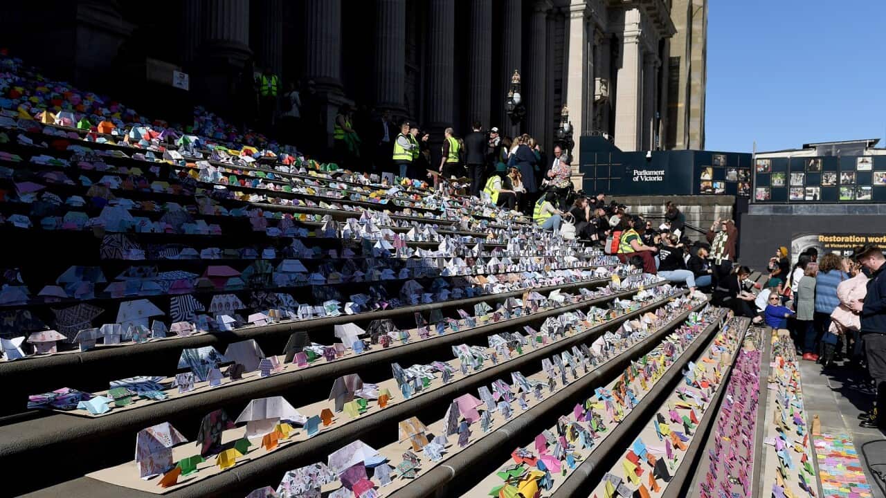 Origami houses highlighting the housing crisis planted on the steps of Victorian Parliament House, in Melbourne in August