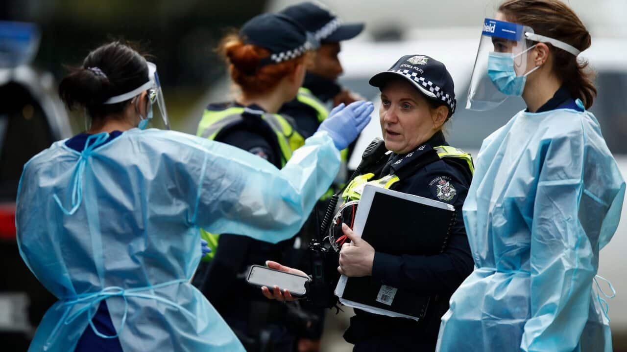COVID-19 testing staff arrive at one of the public housing towers on Racecourse Road in Flemington, Melbourne, Sunday, 5 July, 2020.