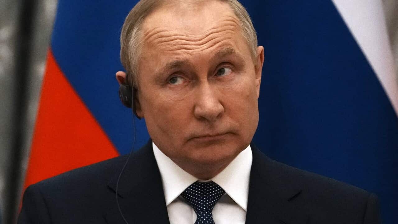 Russian President Vladimir Putin reacts during a joint press conference with French President Emmanuel Macron after their talks in Moscow on 7 February 2022.