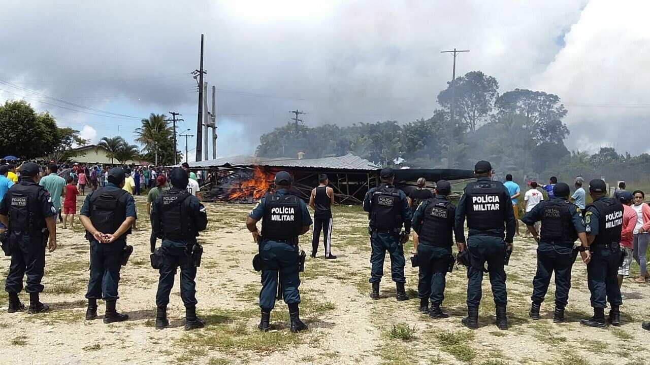 Police try to maintain control as Brazilian people demonstrate against the presence of Venezuelan immigrants in Pacaraima.