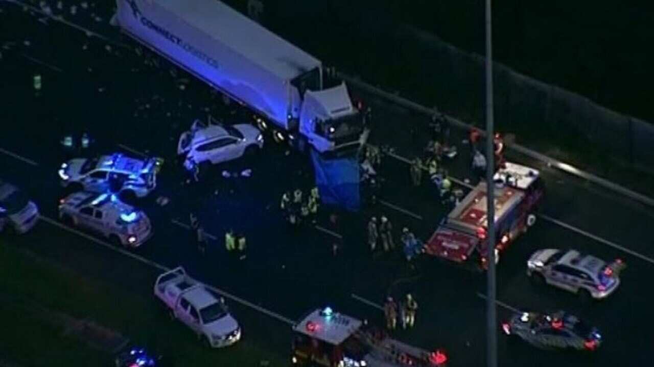 Dozens of emergency workers were called to the crash on inbound lanes of the Eastern Freeway in Kew, Melbourne.