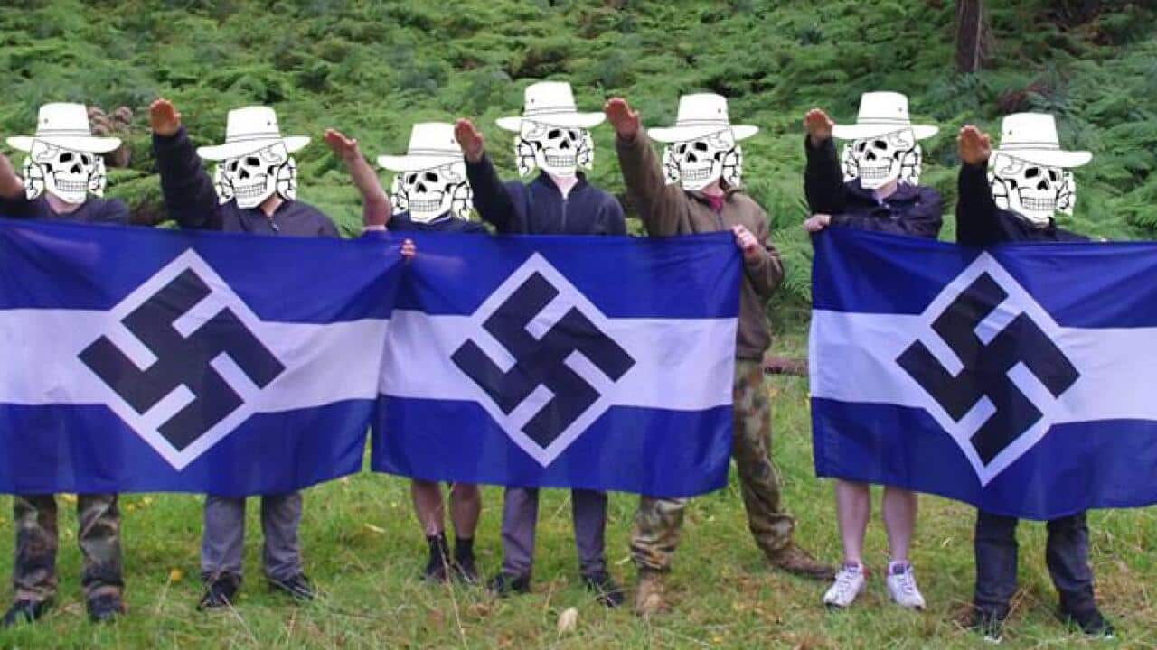 Members of the Antipodean Resistance stand with a Nazi solute.