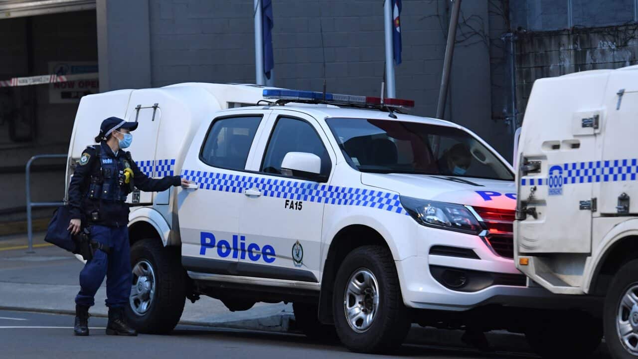 Police are seen outside the Fairfield Police Station in the southwestern suburb of Fairfield in Sydney, Friday, July 9, 2021.