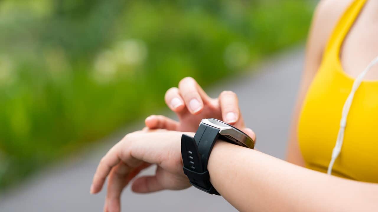 A person checking their wristwatch.