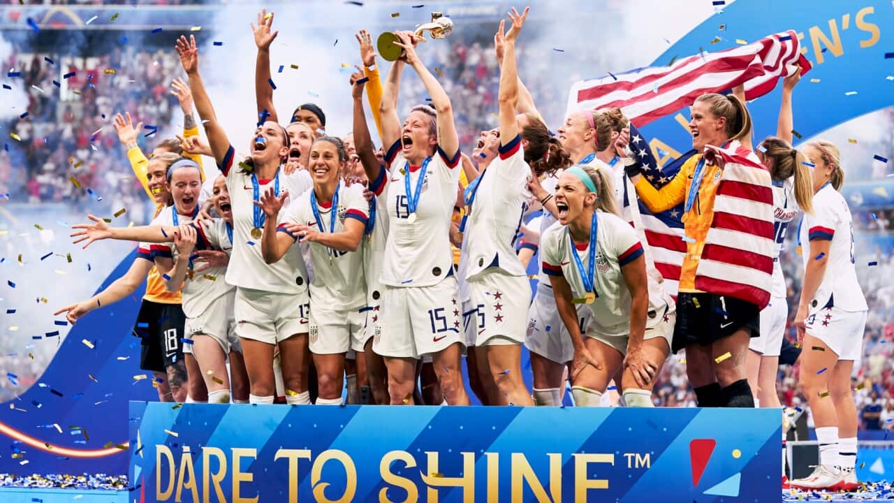 Megan Rapinoe and team-mates celebrate with the FIFA Women's World Cup Trophy