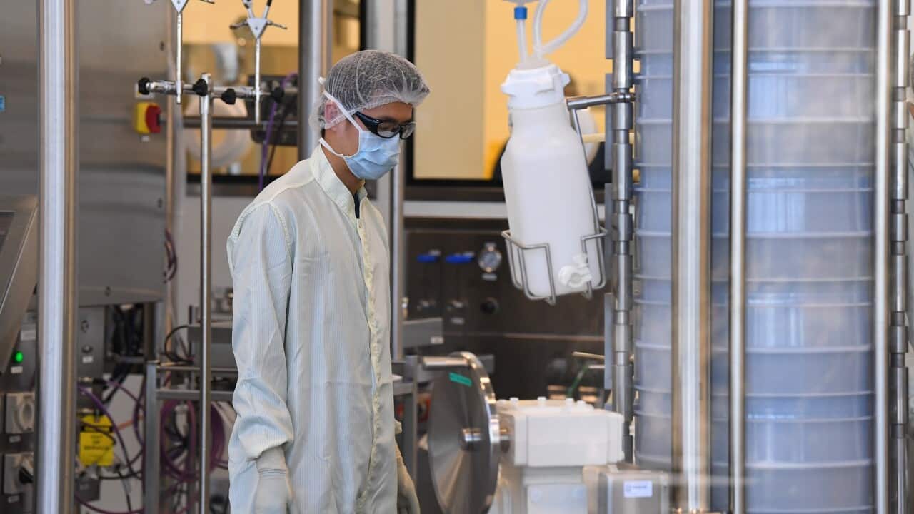 Scientists at work inside of the CSL Biotech facility in Melbourne, where a COVID vaccine is being produced