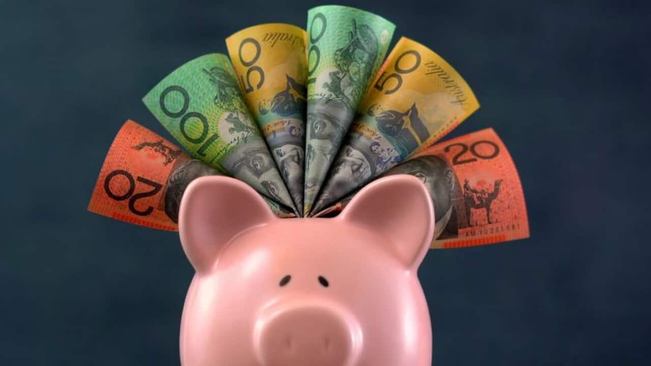 Pink Piggy bank money concept on dark blue background