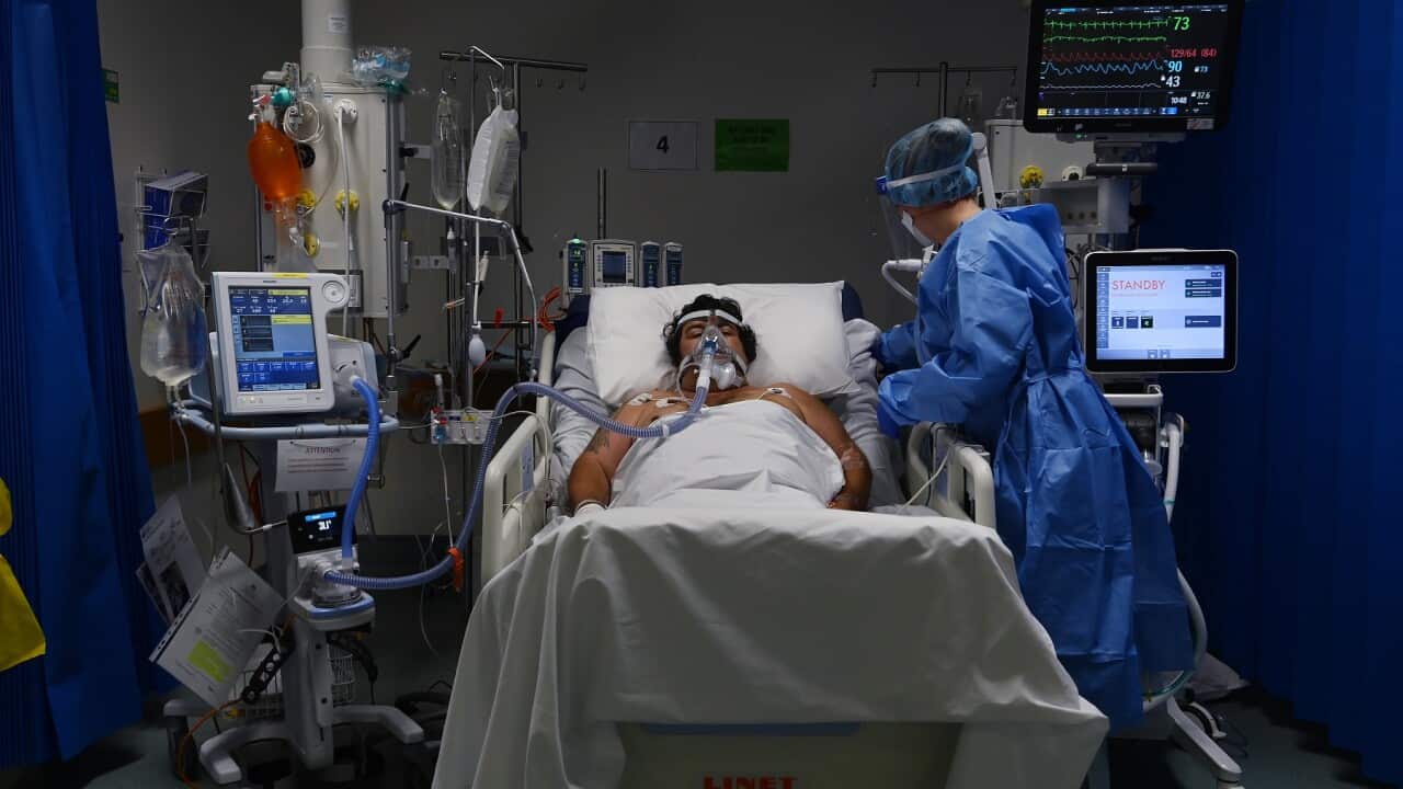 An ICU Registered nurse caring for a COVID-19 positive patient