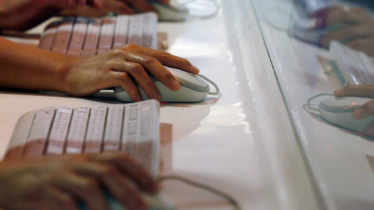 A stock image of people using computers