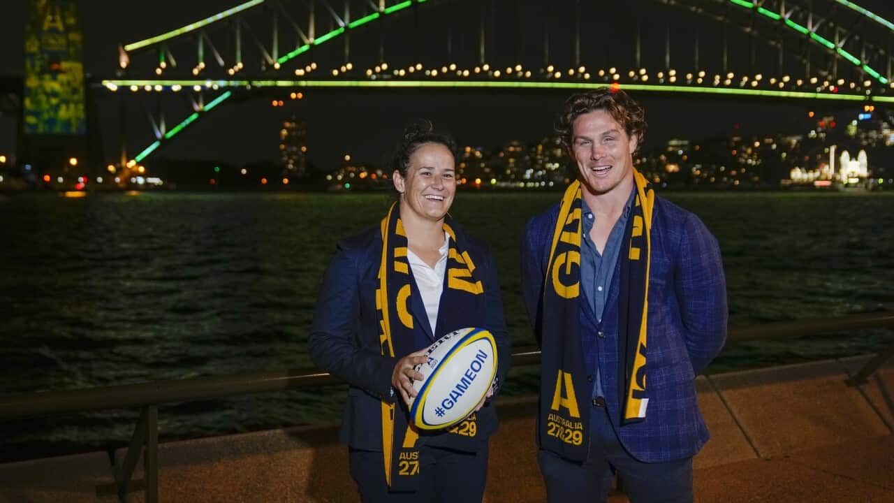 Wallabies captain Michael Hooper stands with Wallaroos captain Shannon Parry ahead of the final vote for the hosting of the Rugby World Cups in Sydney on 12 May 2022. 