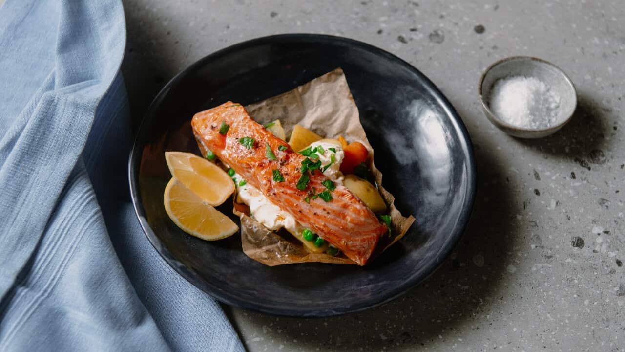 King salmon parcels with potatoes, peas and baby carrots