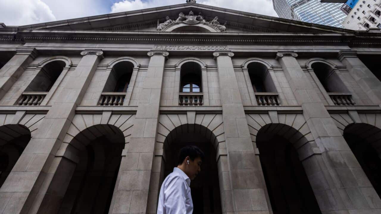 A man walks past a building