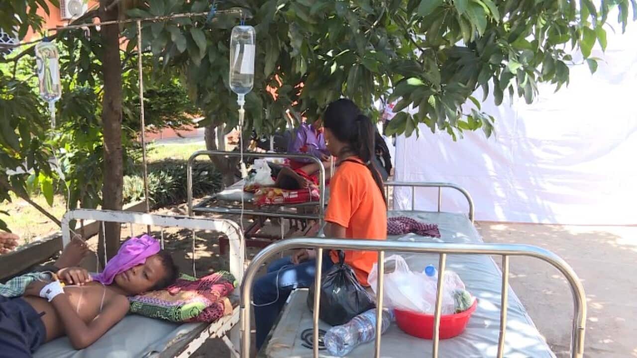 Dengue fever patients stay outside hospital in Kampong Chhnaing, Cambodia