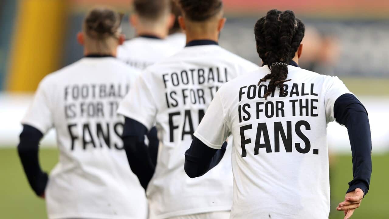 Leeds United players wearing 'Football Is For The Fans' shirts ahead of a match with Liverpool