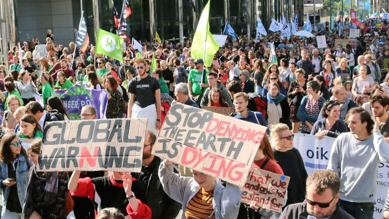Young people appeal for global action on climate change at a rally in front of the European Union's headquarters in Brussels on Sept. 20, 2019, ahead of the U.N. Climate Action Summit on Sept. 23. (Kyodo via AP Images) ==Kyodo