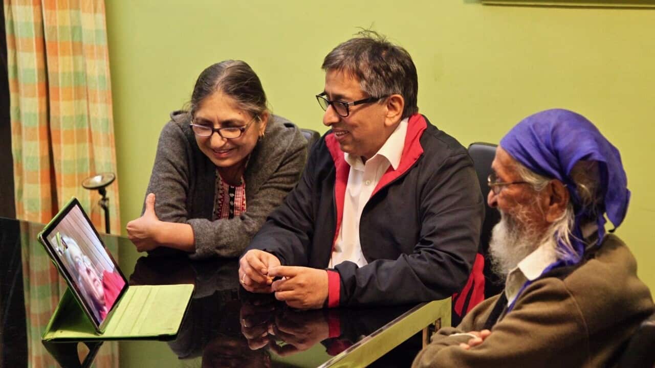 (L-R) Neerja and Jatinder Ahuja with Jatinders dad speak to family in Delhi