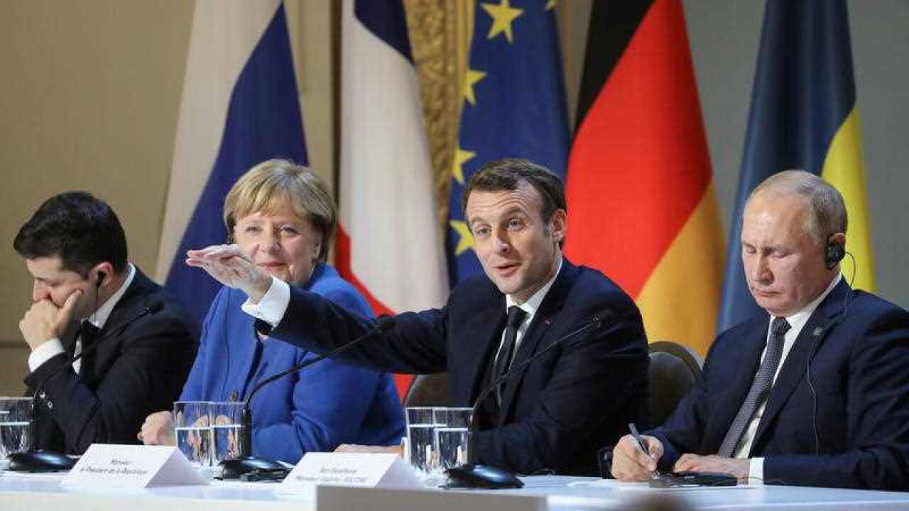 Ukrainian President Volodymyr Zelenskyy, German Chancellor Angela Merkel, French President Emmanuel Macron and Russian President Vladimir Putin address the media