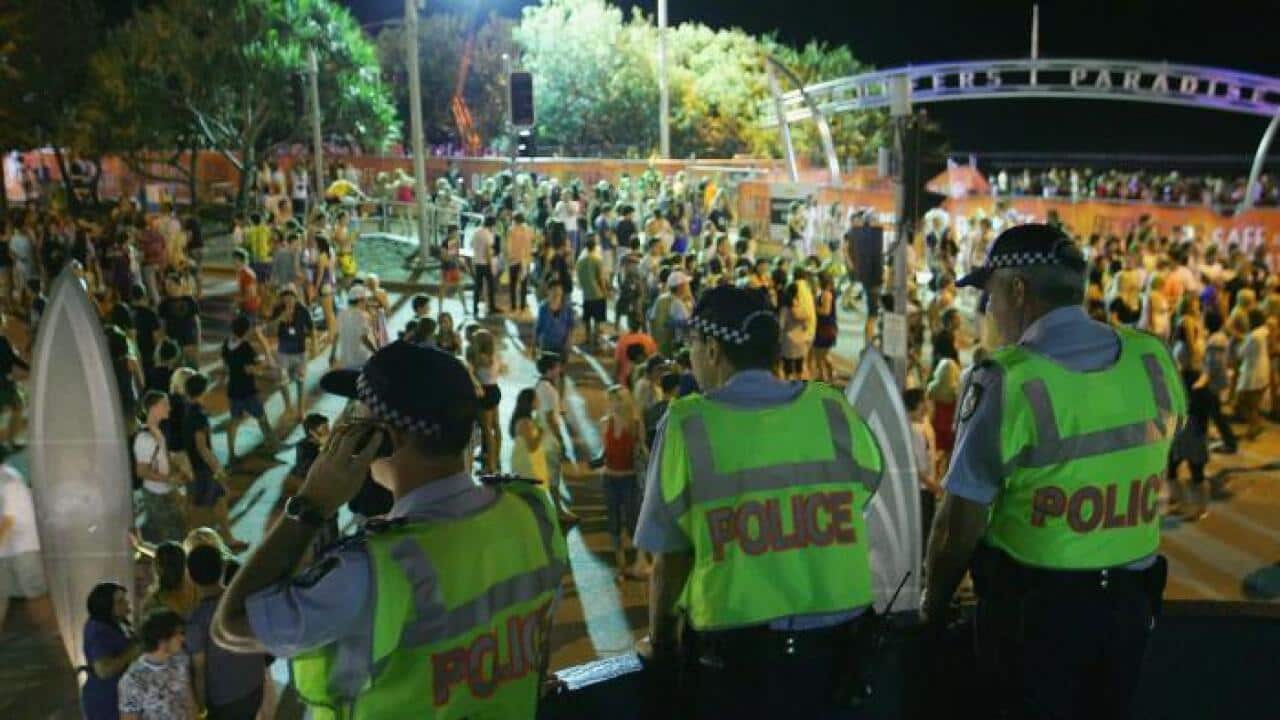 Police officers watch over the Schoolies week celebrations in Surfers Paradise on the Gold Coast. (Sergio Dionisio/Getty Images)