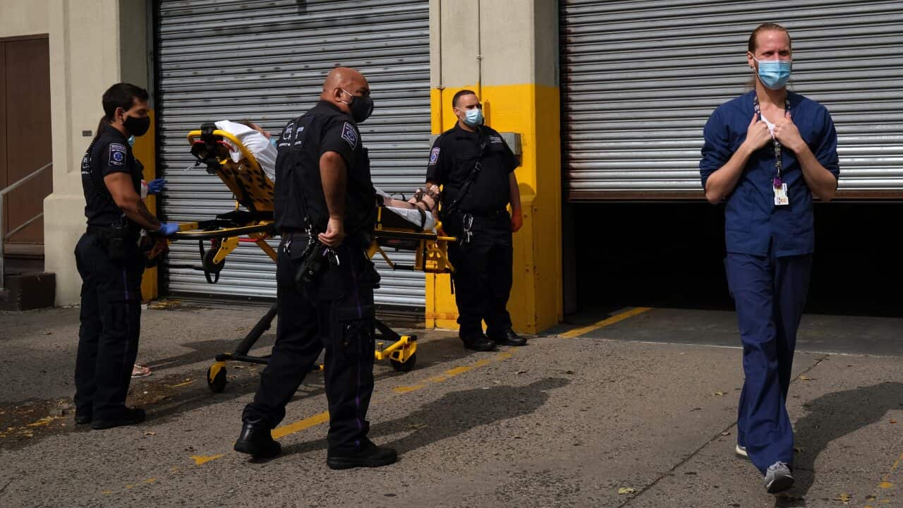 Medical workers deliver a patient to a hospital in Brooklyn - New York city -(Getty)