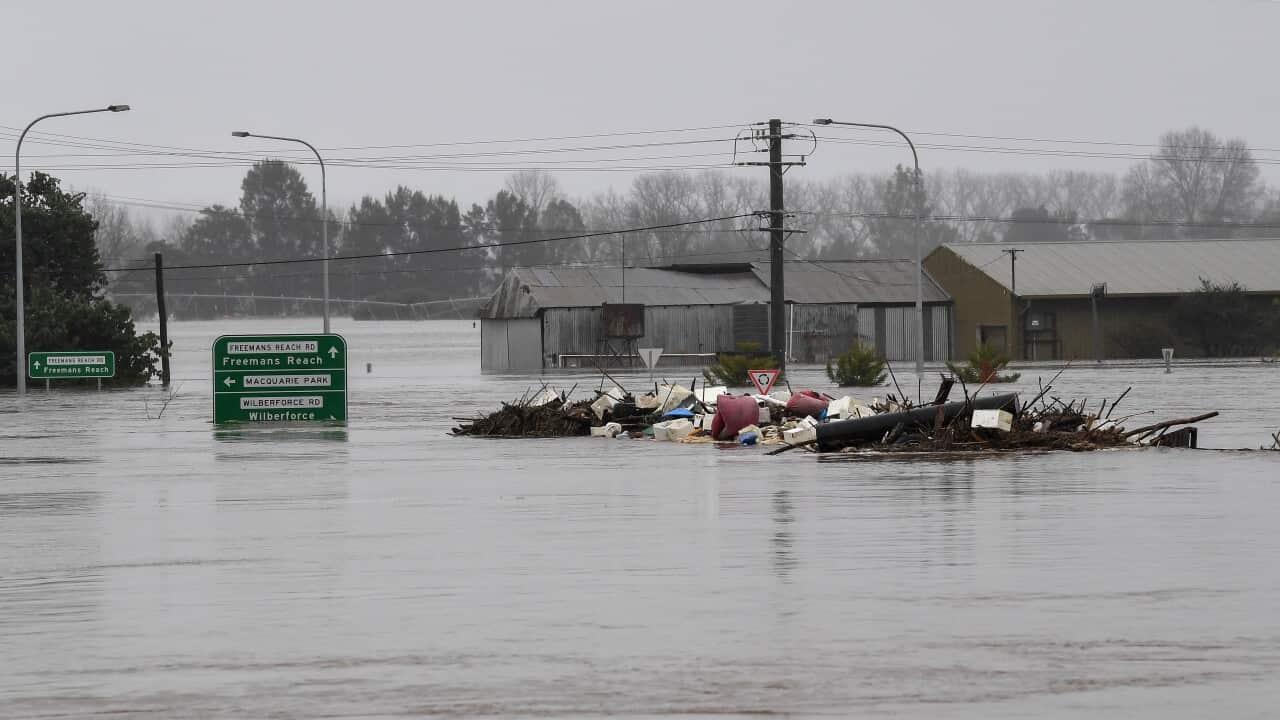 Debris is seen as the the Windsor Bridge is submerged under floodwater from the swollen Hawkesbury River, in Windsor, north west of Sydney.