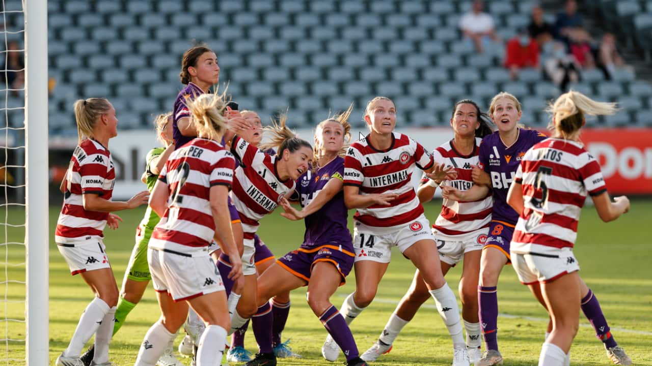 Wanders and Glory players concentrate on an incoming corner kick during the A-League Women match.