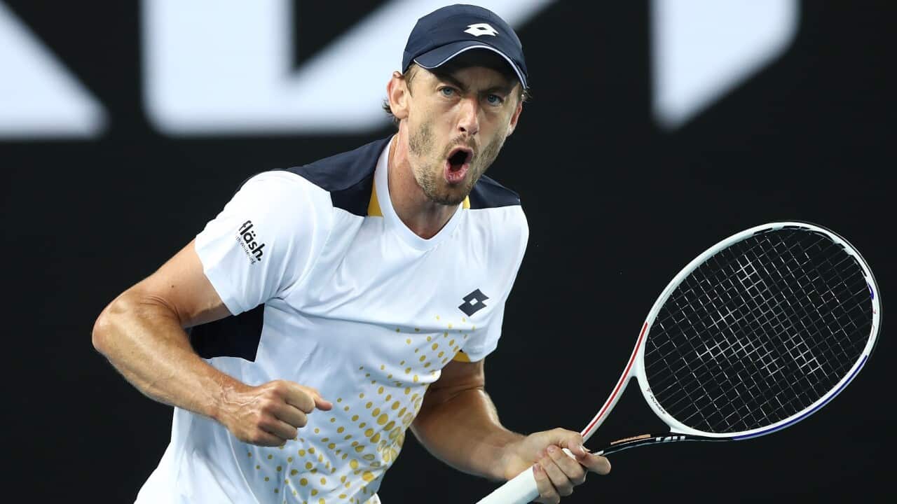 John Millman of Australia reacts after winning a point in his first round singles match against Feliciano Lopez of Spain during day one of the 2022 Australian Open