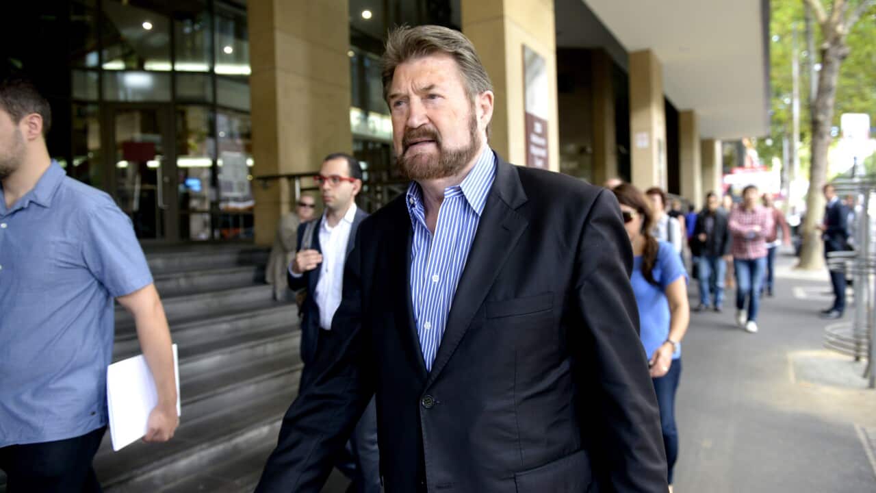 Journalist Derryn Hinch arrives at the Melbourne Magistrates Court in Melbourne, Friday, Feb. 27, 2015. Hinch is fighting to be exempt from compulsory voting due to his job. (AAP Image/Tracey Nearmy) NO ARCHIVING