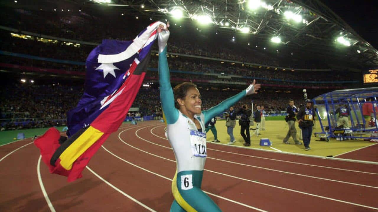 Cathy Freeman again ran a lap of honour carrying the Australian and Aboriginal Flags at the Sydney 2000 Olympic Games, after winning Gold in the Women's 400 meters Finals.