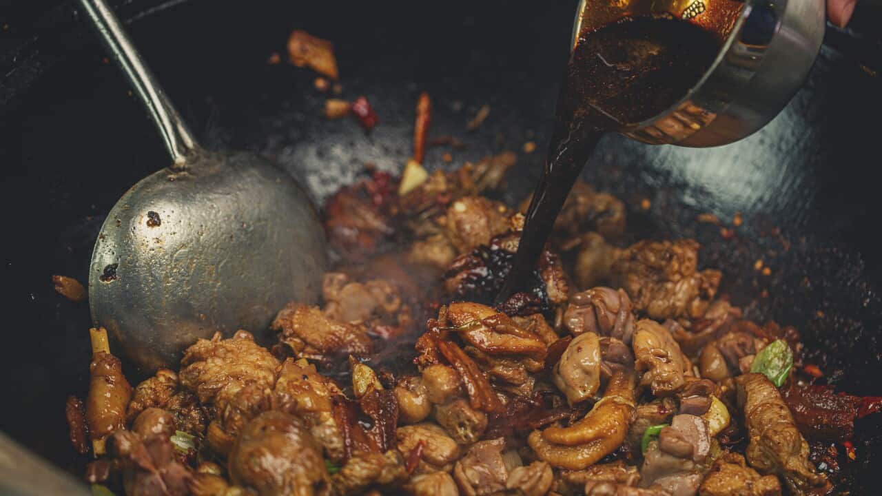 Chicken stir-fry meat in a wok