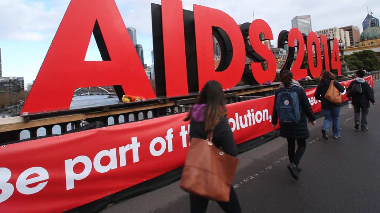 A large sign for AIDS conference on the Princes bridge in Melbourne