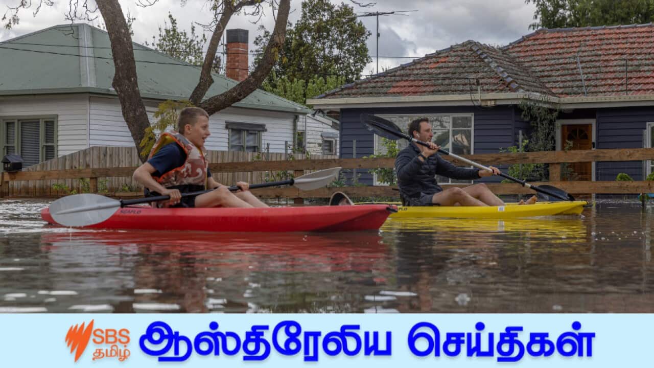 Residents in the suburb of Maribyrnong canoe down a flooded street in Victoria, Australia