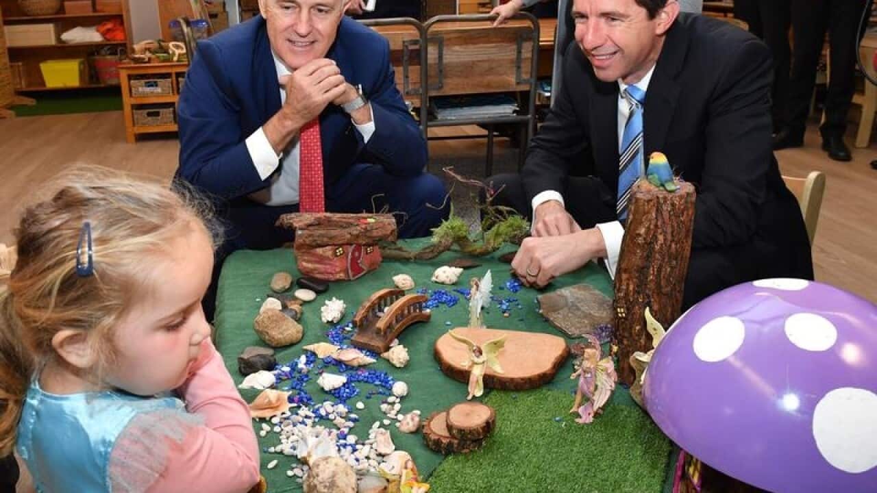 Malcolm Turnbull and Simon Birmingham at a childcare centre.