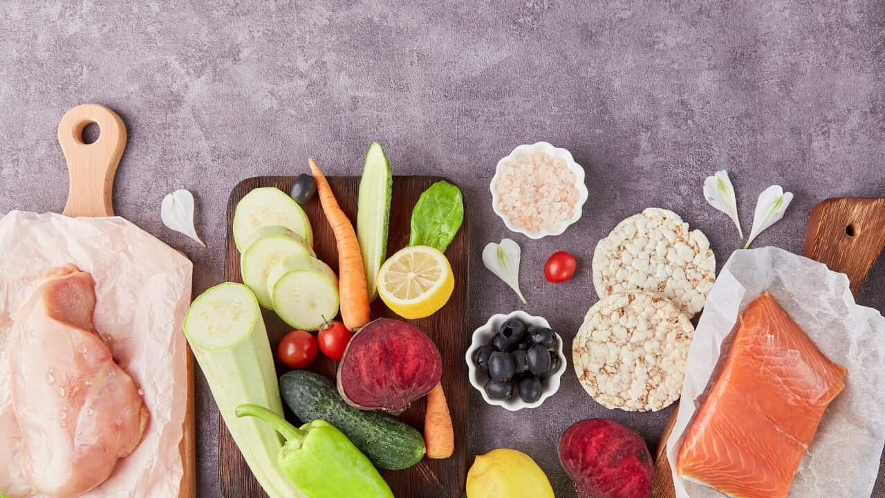 Aesthetics vegetables, chicken fillet, olives, salmon and greens top view. Keto, Paleo, Low carb, FODMAP diet concept