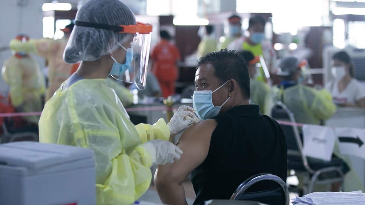 A man receives a dose COVID-19 vaccine at a vaccination center in Vientiane(Kaikeo Saiyasane - Xinhua via Getty Images)