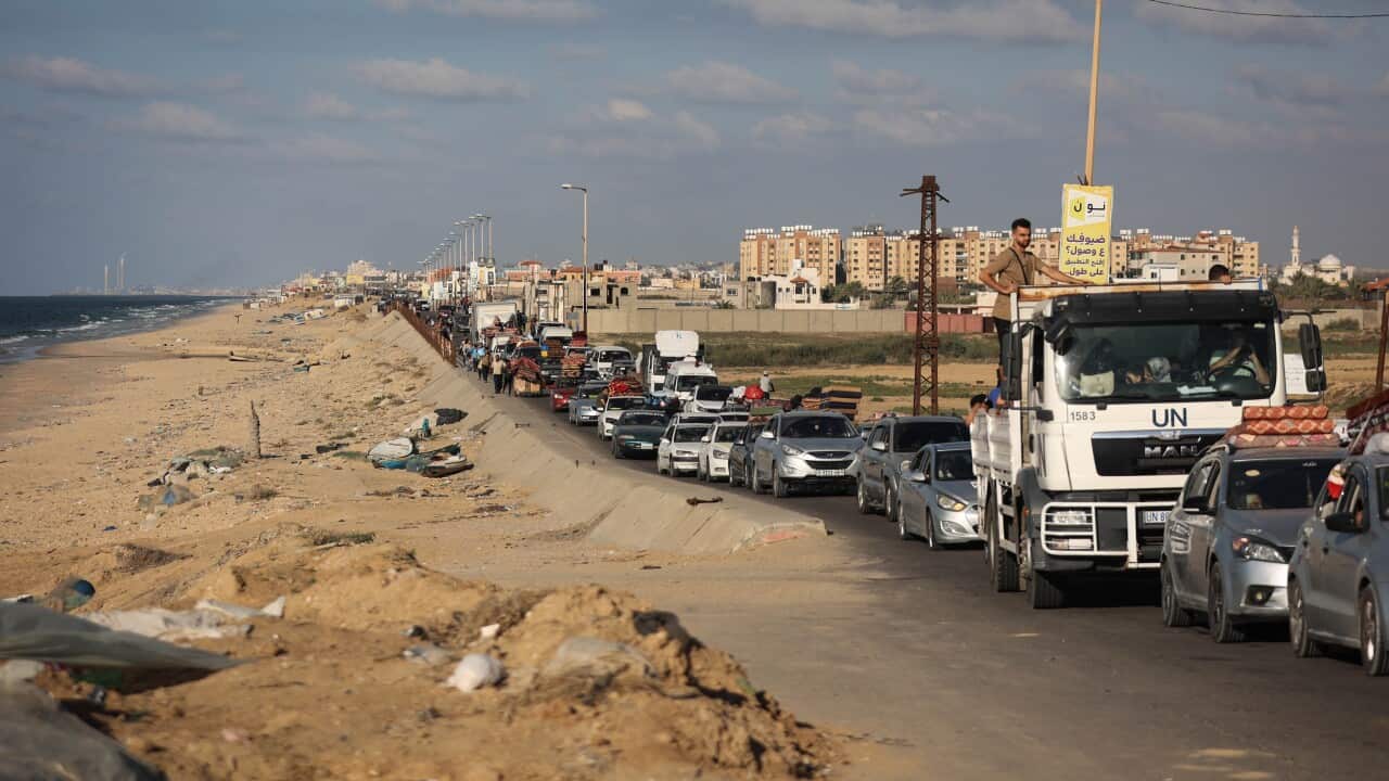 A long row of cars moving slowly down a road