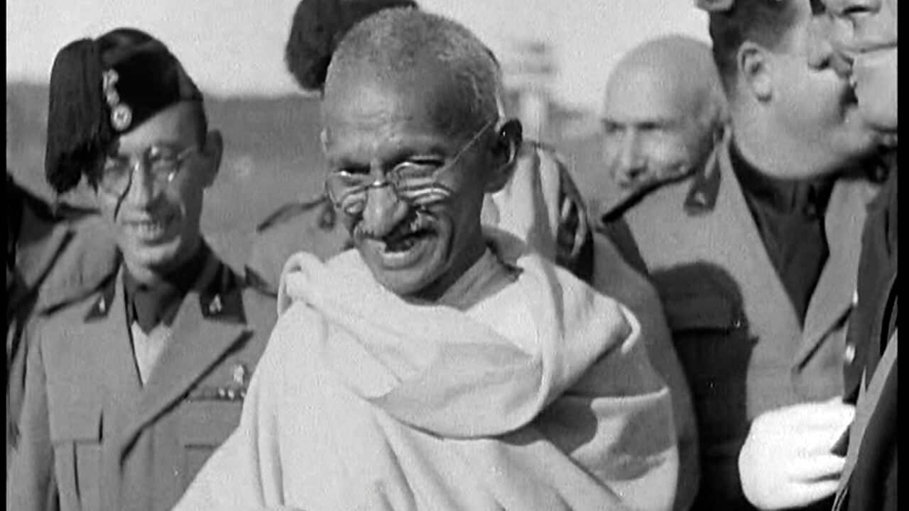 Mahatma Gandhi Standing With Others. Date: 1930