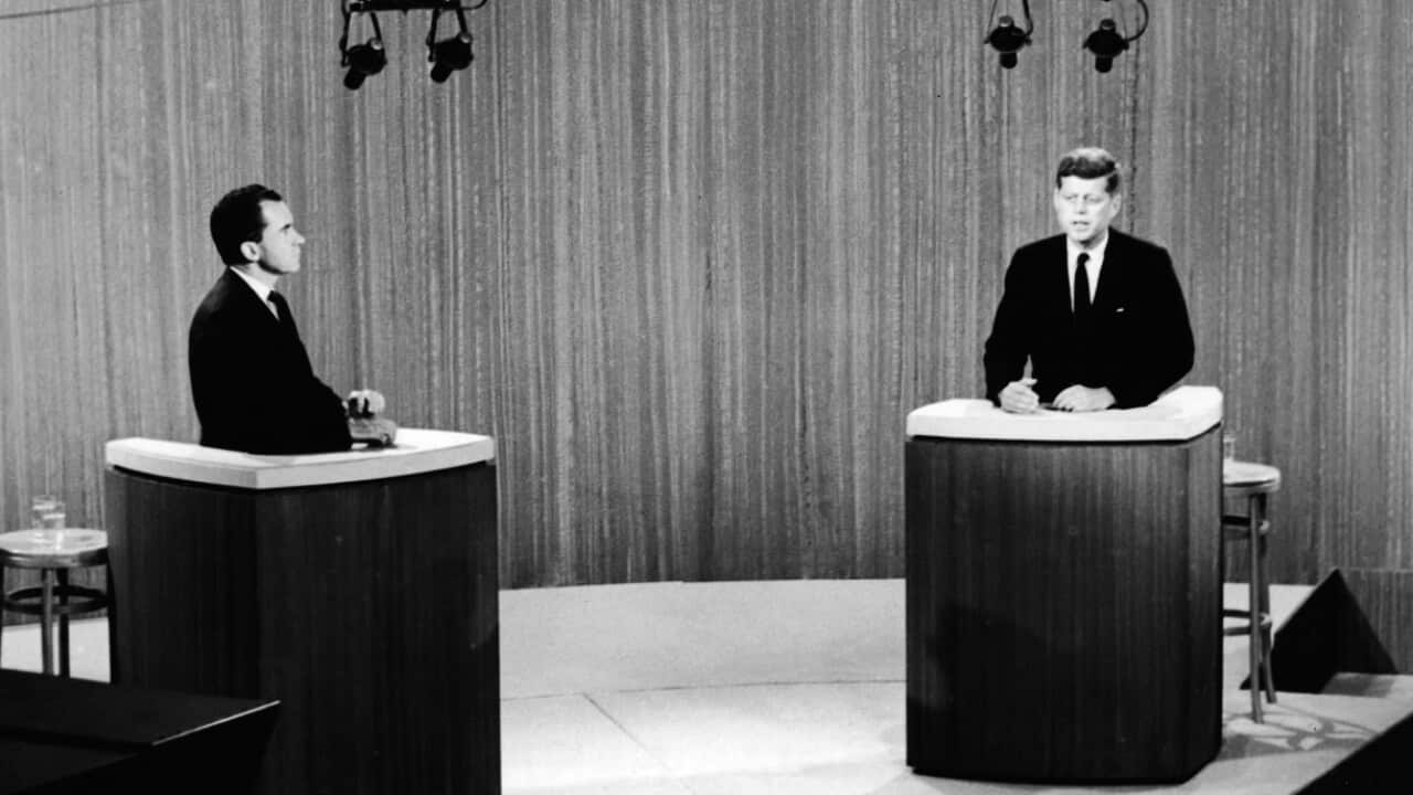 Republican vice president Richard Nixon (1913-1994) (L) and democratic senator John F. Kennedy (1917-1963) stand at podia duirng a debate in 1960