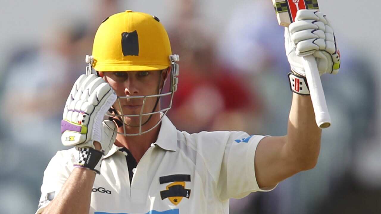 Chris Lynn acknowledges the crowd after reaching 100