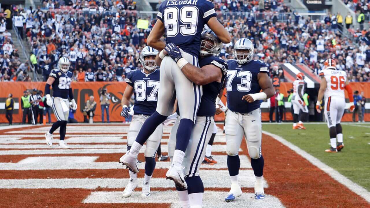 Dallas Cowboys tight end Gavin Escobar (C) celebrates his touchdown
