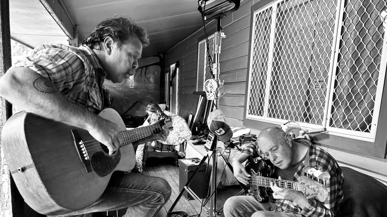 Playing through an arrangement on the verandah before we hit record....jpeg