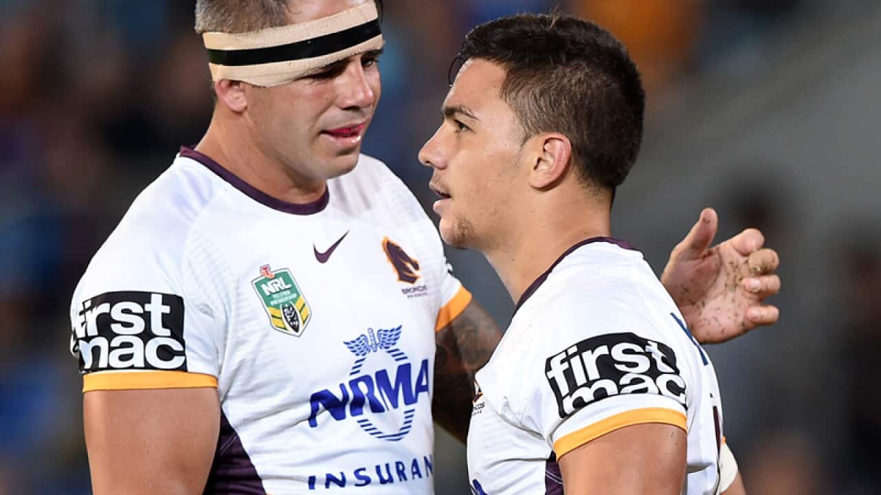 Broncos captain Corey Parker (left) congratulates Kodi Nikorima
