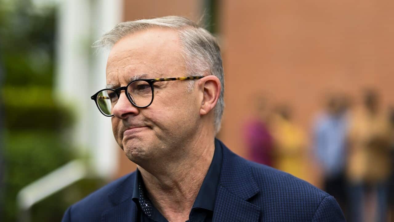 Australian Opposition Leader Anthony Albanese speaks to the media clarifying an earlier answer after attending the Easter Sunday mass at St. Monicas on Day 7 of the 2022 federal election campaign, in Cairns, Sunday, April 17, 2022. (AAP Image/Lukas Coch)