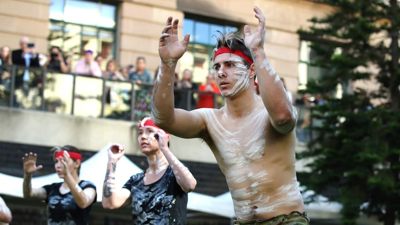 Indigenous members of the defence force perform a ceremonial dance during the unveiling of a memorial to Aboriginal and Torres Strait Islander service men and women at ANZAC Square in Brisbane, on the first day of National Reconciliation Week in 2022.