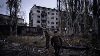 Ukrainian servicemen checking the area next to destroyed buildings in the frontline town of Kostyantynivka