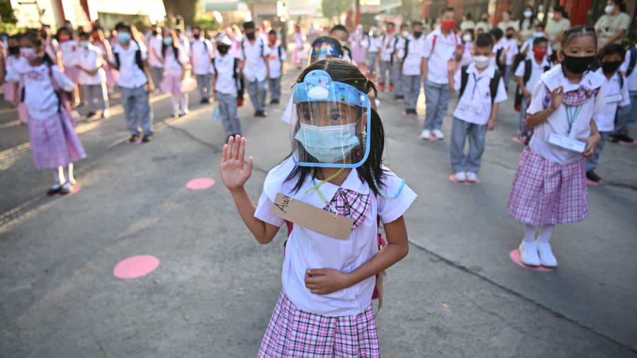 File Photo: Students attend a flag raising ceremony at Ricardo P. Cruz elementary school in Taguig city Philippines December 6, 2021