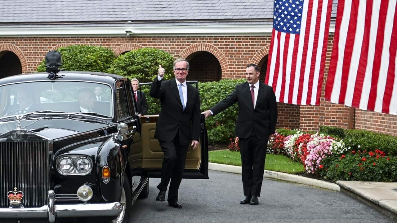 US Ambassador to Australia Arthur B. Culvahouse arrives in a Rolls-Royce.