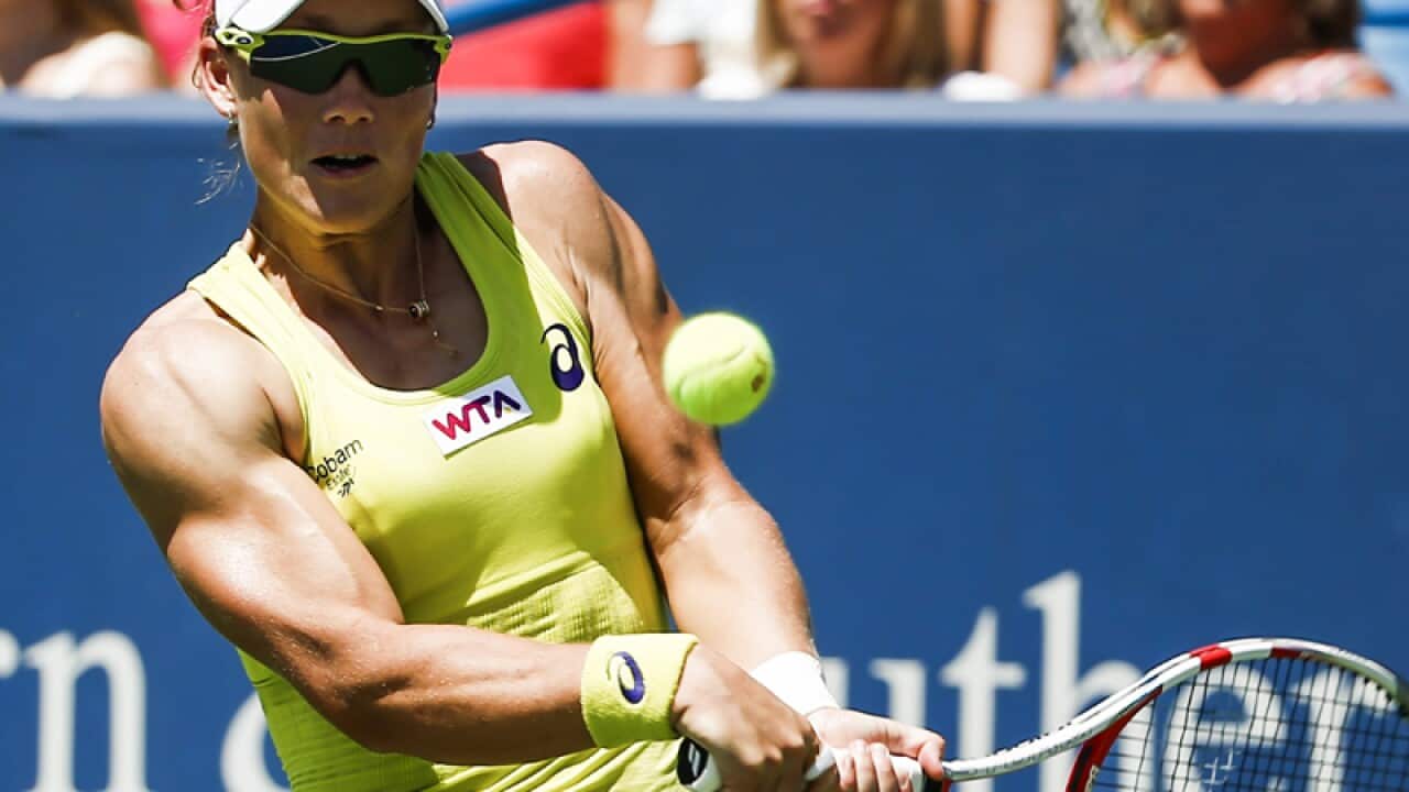 Samantha Stosur returns the ball.