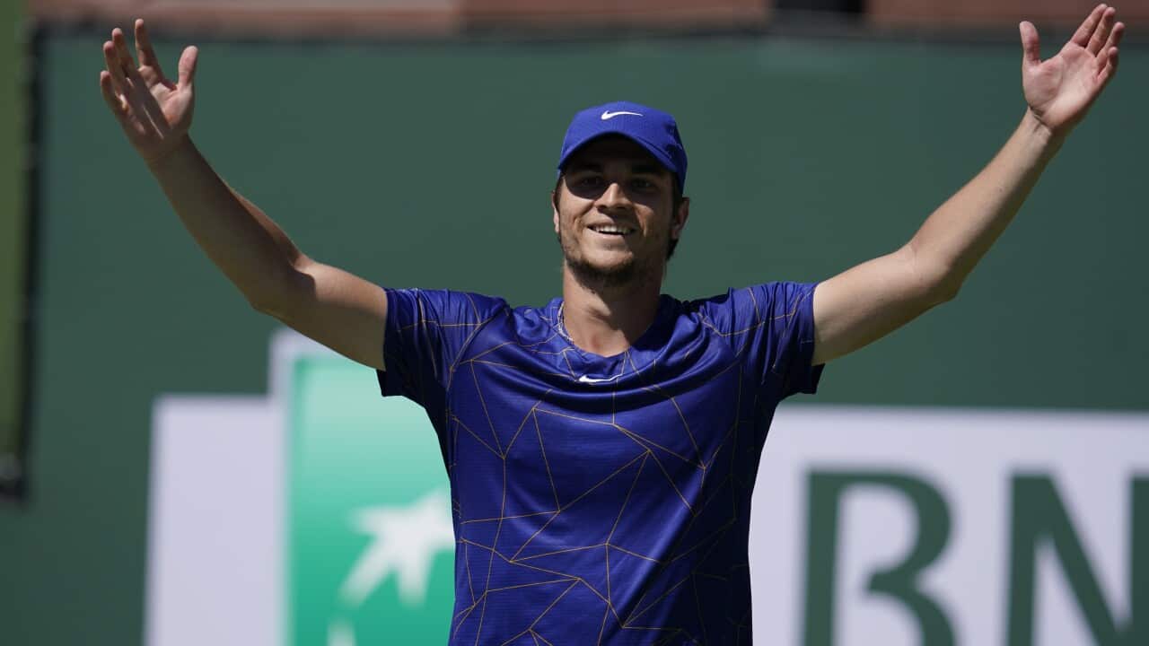 Miomir Kecmanovic, of Serbia, celebrates after defeating Matteo Berrettini, of Italy, at the BNP Paribas Open tennis tournament Wednesday, March 16, 2022, in Indian Wells, Calif. (AP Photo/Marcio Jose Sanchez)