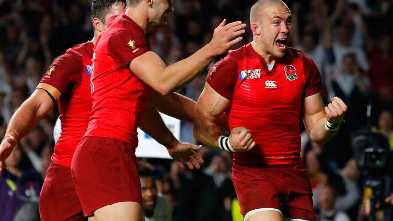 England's Mike Brown celebrates his try.